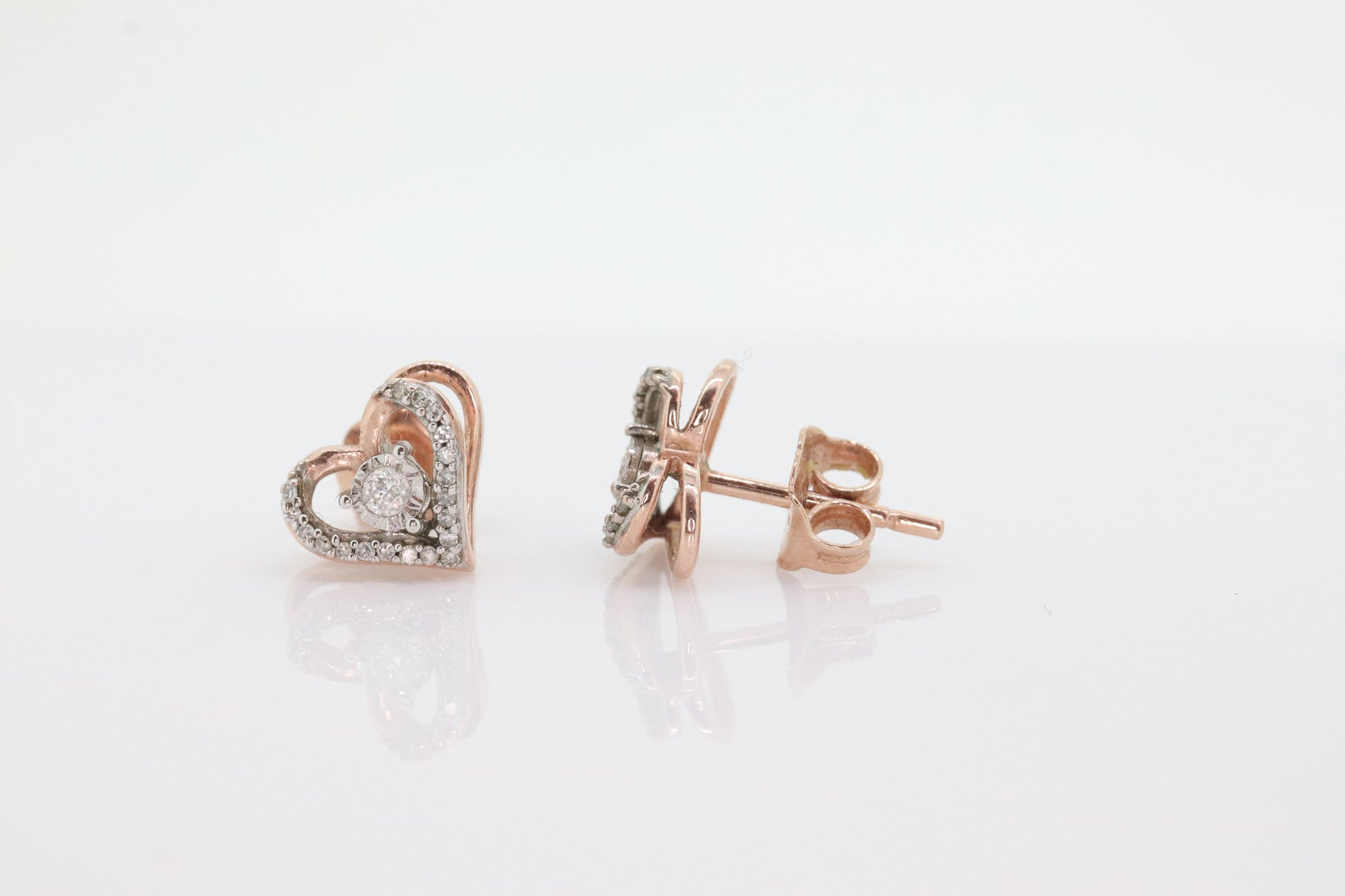 10k Open Heart Rose Gold Diamond Stud earrings. Halo set diamond earrings. st(115)