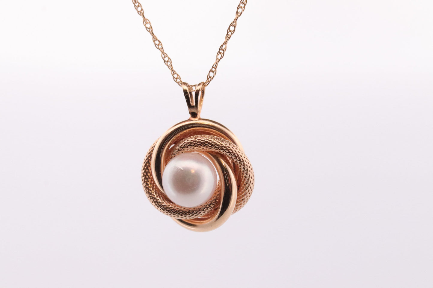14k Pearl Rope coil Necklace. Pearl Love Knot Pendant Necklace.