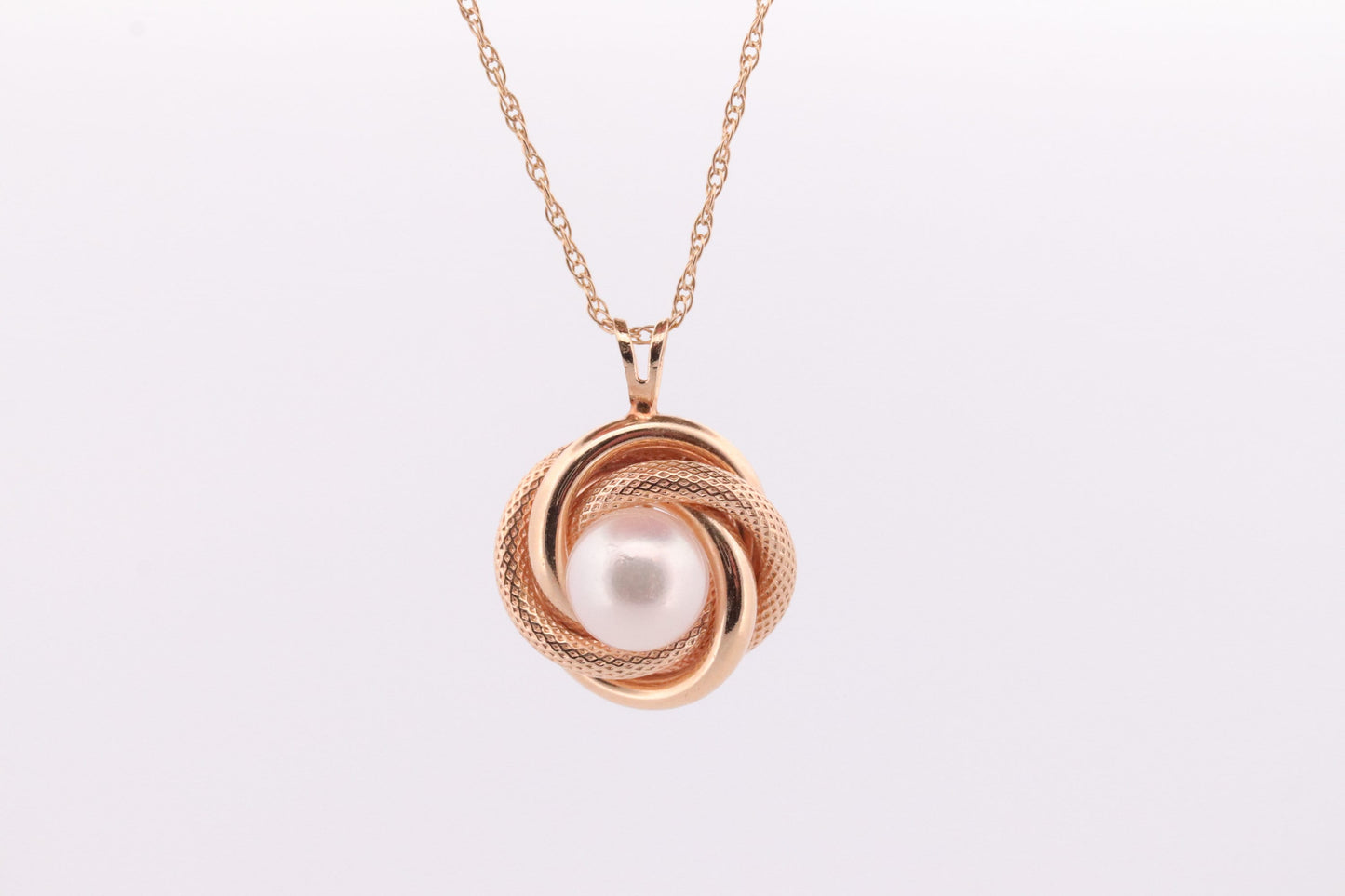 14k Pearl Rope coil Necklace. Pearl Love Knot Pendant Necklace.