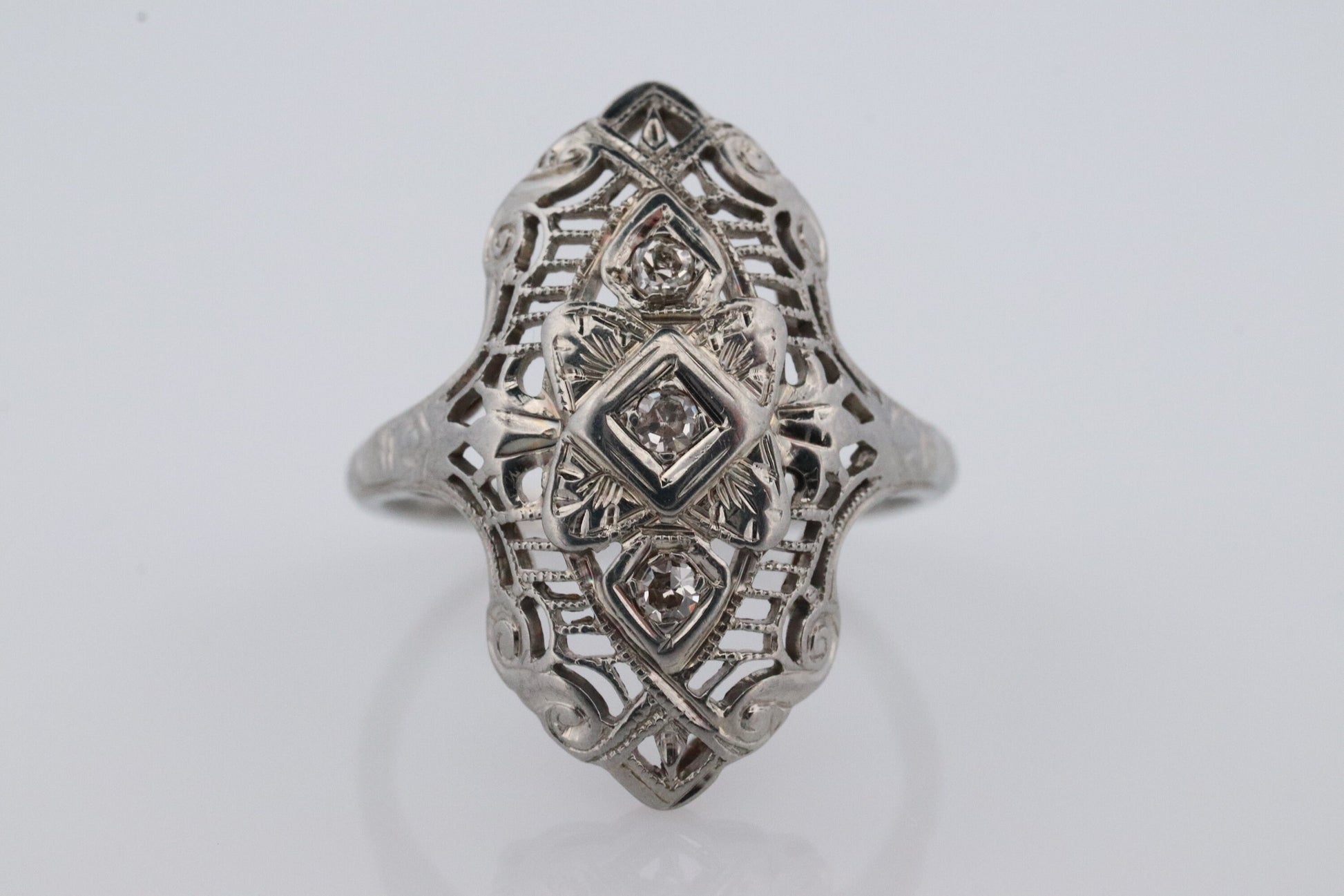 18k Filigree three diamond shield ring. 18k Art Deco trio triple diamond shield ring. Antique Shield Diamond ring.