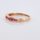 14k Eternity Half Ruby Ring. A 14k gold ring with round Ruby half eternity anniversary band.