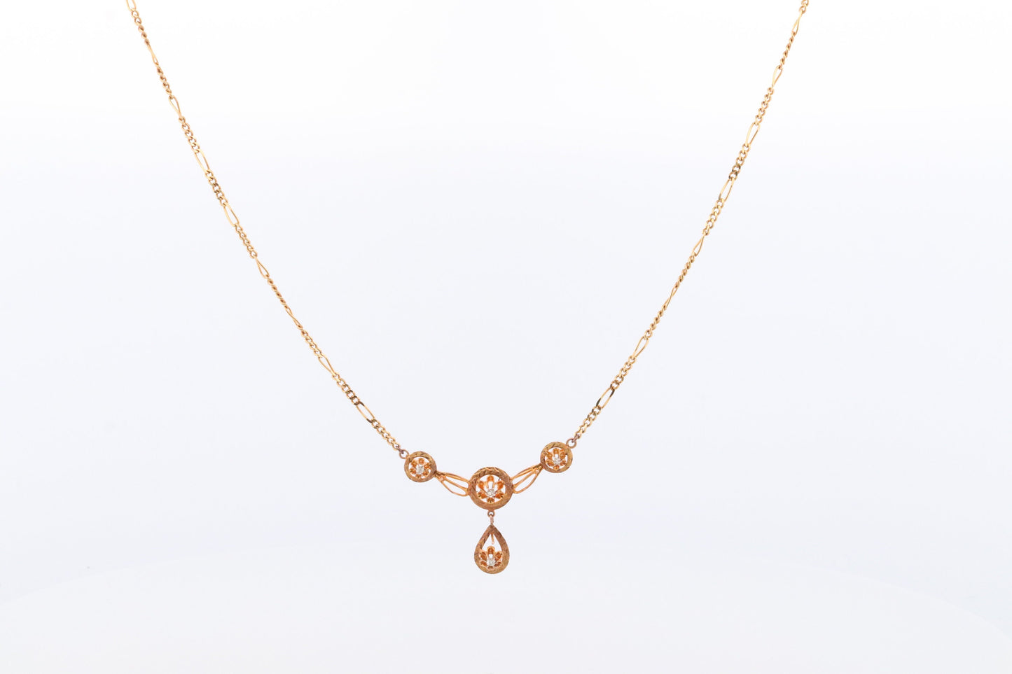 Diamond pendant lavaliere. 14k Gold with a diamond set buttercup necklace. Figaro Chain necklace. Balestra