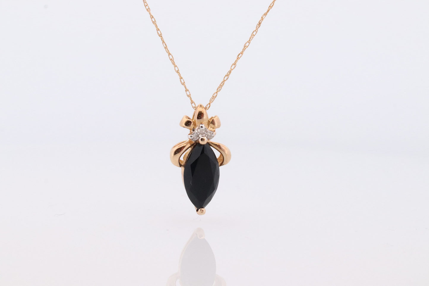 10k Onyx and Diamond Pendant. Marquise faceted Onyx and Diamond accent Pendant. Thin wheat chain necklace.