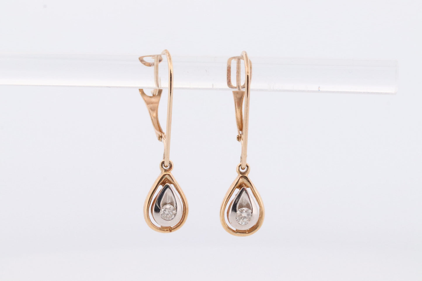 10k Diamond Dangle Earrings. Diamond Drop Teardrop Diamond Dangle earrings. Yellow and White Gold bezel set diamond.