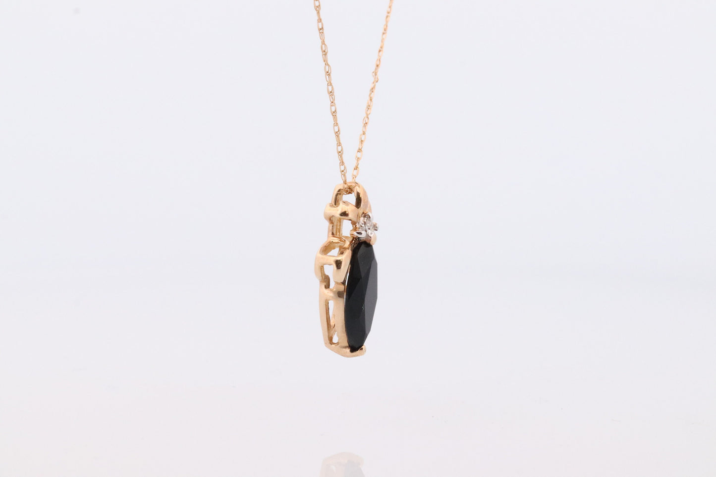 10k Onyx and Diamond Pendant. Marquise faceted Onyx and Diamond accent Pendant. Thin wheat chain necklace.