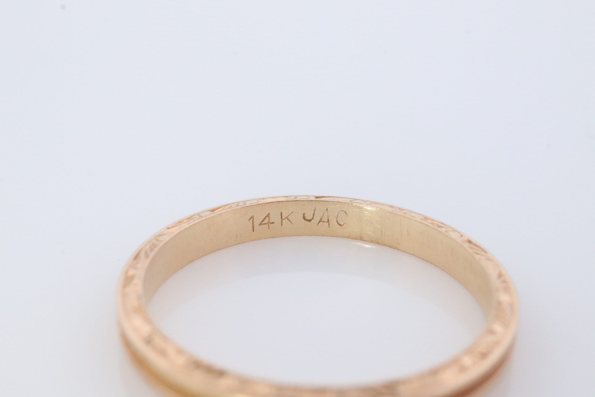 14k Engraved Band. 14k Yellow Gold Train Tracks and Floral Detailed engraving on the side. Fine Hand Engraved pattern ring. JAC