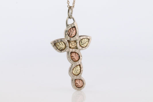 Black Hills Gold Cross Necklace. Sterling Silver with 10k/12k multi tone Black Hills Gold Crucifix Pendant.