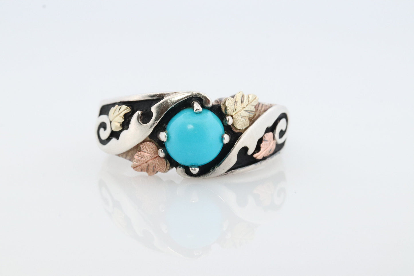 Black Hills Gold Turquoise ring. Sterling Silver and 12k/10k Gold Leaf inlays. Robin Egg color Turquoise cabochon solitaire.