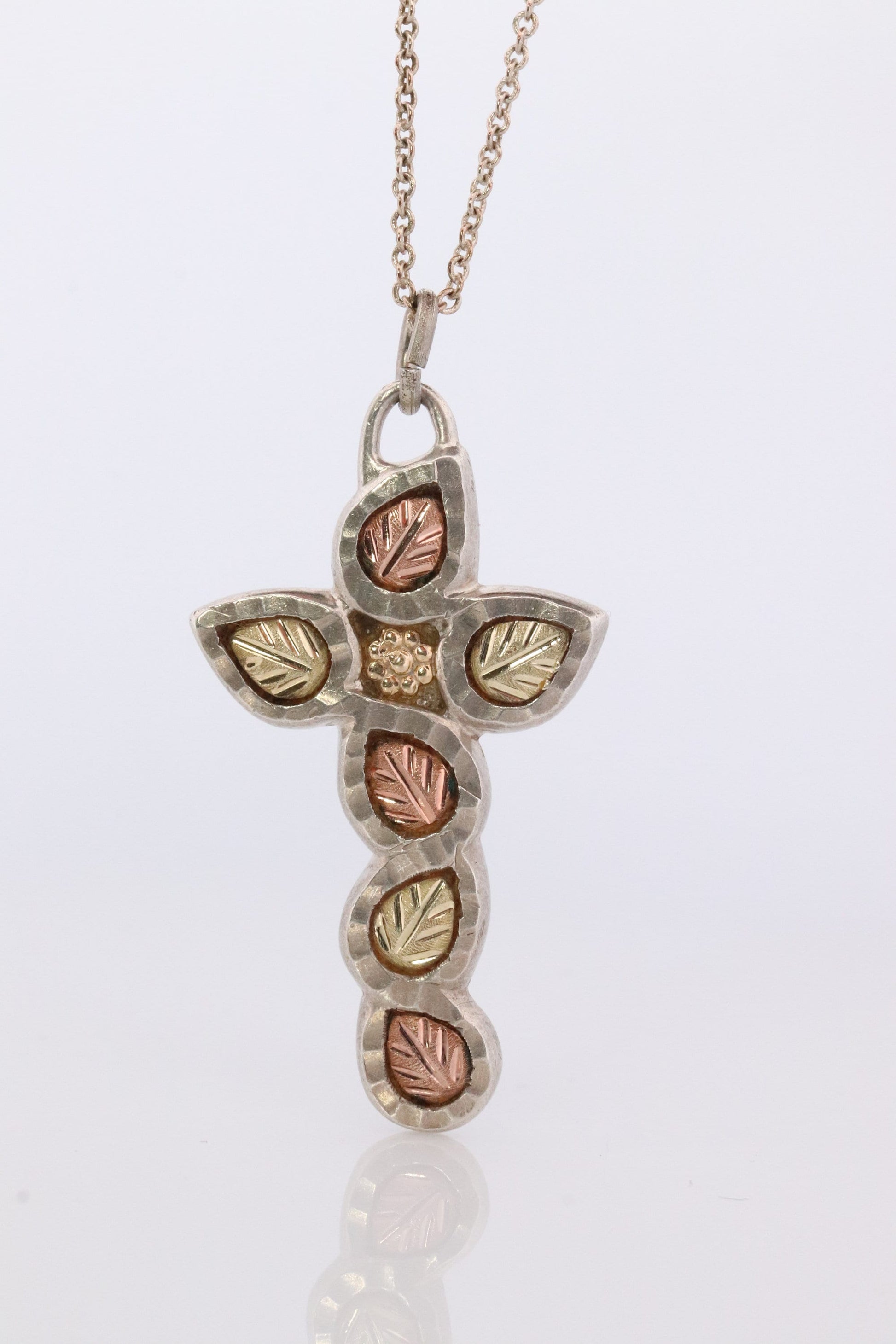 Black Hills Gold Cross Necklace. Sterling Silver with 10k/12k multi tone Black Hills Gold Crucifix Pendant.