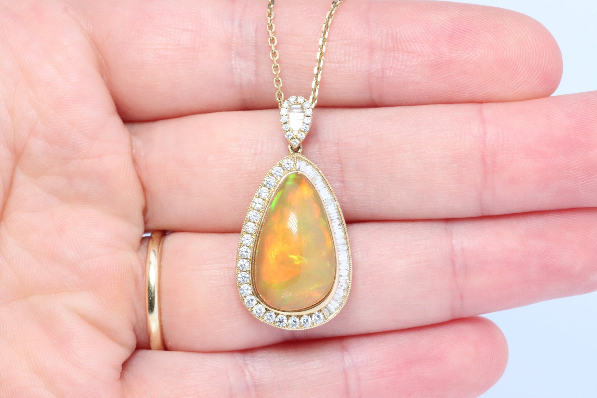 Opal and Diamond Halo 14k pendant. Large Natural Pendant Surrounded by Baguette and Round Diamonds. Pear Opal Cabochon. Appraised.