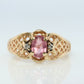14k Pink Tourmaline Ring. prong set OVAL Tourmaline solitaire with diamond accents.