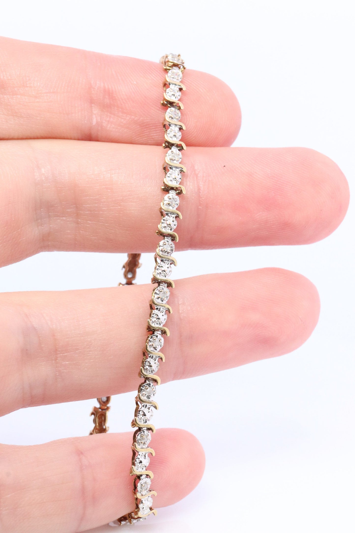 10k Diamond Tennis Bracelet. 10k S-LINK round diamond Tennis bracelet.