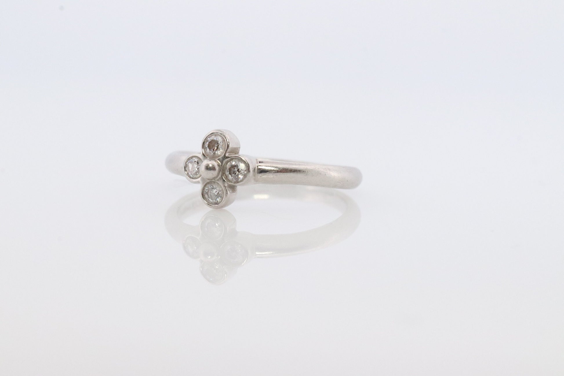 Vintage Tiffany and Co. Diamond Ring. Authentic Tiffany Platinum Diamond wave Band. T&CO Clover Flower Diamond ring.