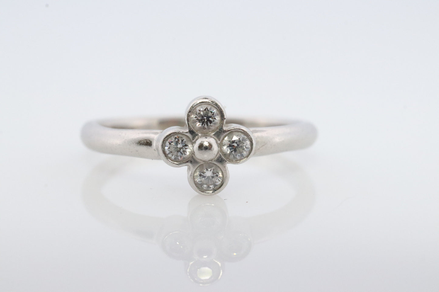 Vintage Tiffany and Co. Diamond Ring. Authentic Tiffany Platinum Diamond wave Band. T&CO Clover Flower Diamond ring.