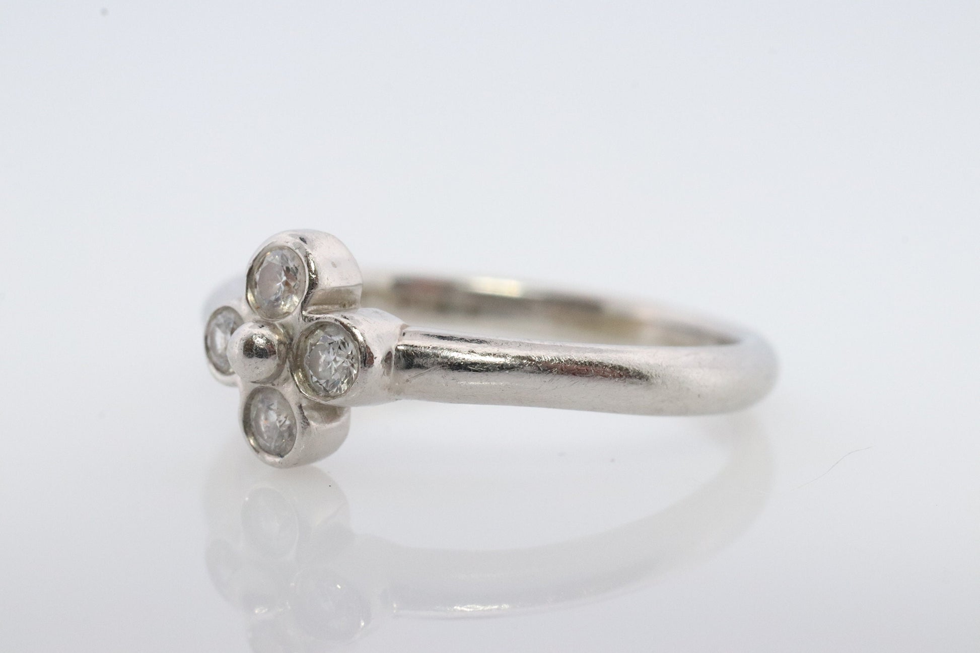 Vintage Tiffany and Co. Diamond Ring. Authentic Tiffany Platinum Diamond wave Band. T&CO Clover Flower Diamond ring.