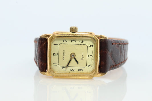 Bucherer Quartz wristwatch. Gold-tone bezel SWISS battery watch. Minimalist design. Serviced. Model 40171 Dp