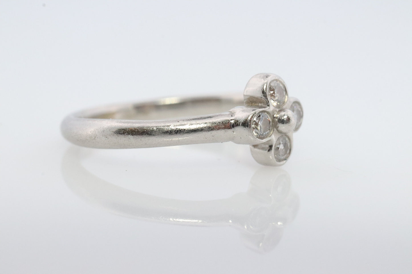 Vintage Tiffany and Co. Diamond Ring. Authentic Tiffany Platinum Diamond wave Band. T&CO Clover Flower Diamond ring.